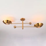 Perspective view of the Luna Modern Double Bowl Chandelier featuring asymmetrical bowl shades and Mid-Century Modern brass design