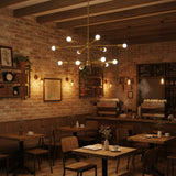 Lyon 12 light Mid-Century Modern tiered Sputnik chandelier shown from an opposite angled view with exposed globe bulbs.