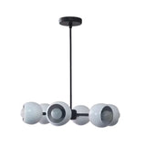 Marbella 6 light dome chandelier shown from the side with rounded white shades, exposed bulbs, and a streamlined black frame.