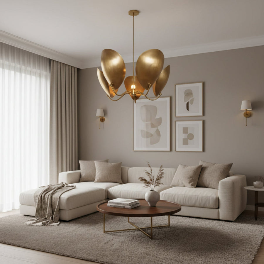 Mayfair 5 light aged brass sculptural chandelier shown from the front with curved petal-inspired metal shades.