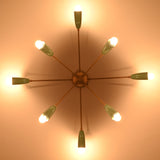 Warm-lit 8-light mint cone starburst chandelier viewed from below