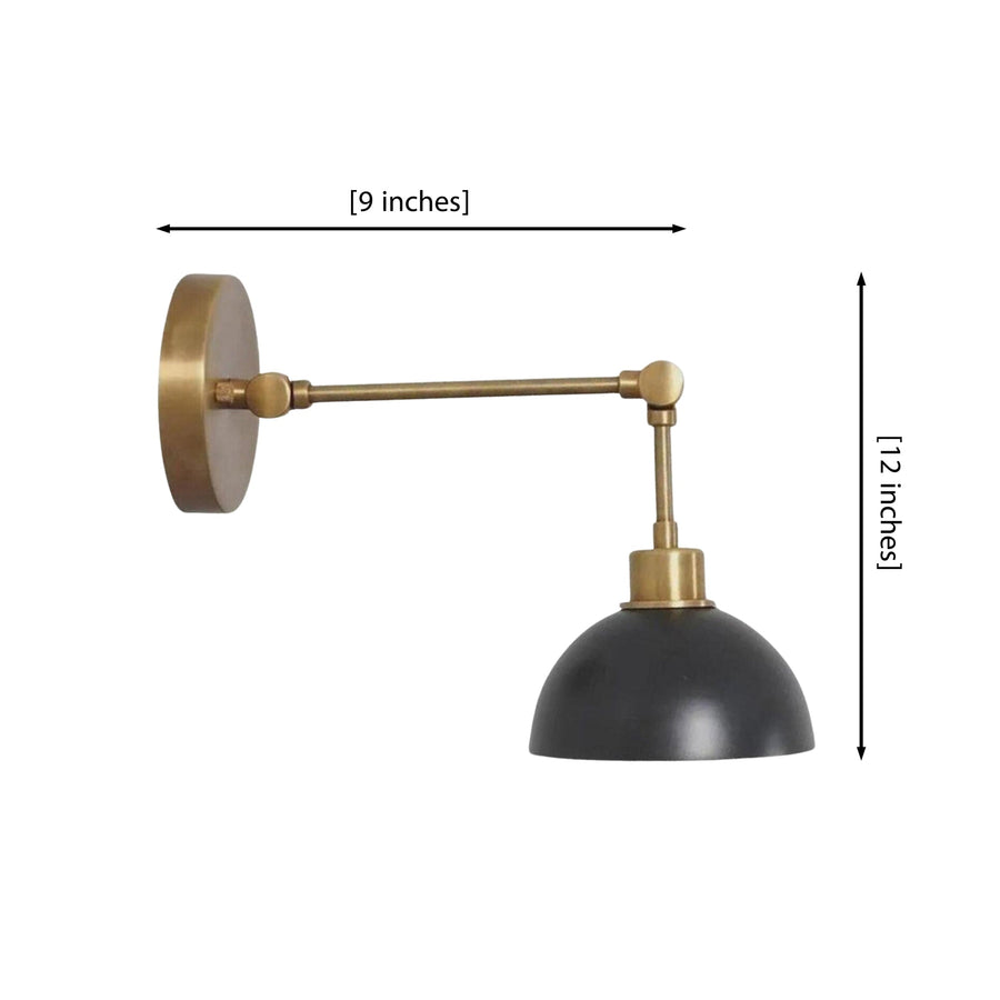 Milan adjustable brass dome wall sconce installed beside an armchair in a warm modern living room