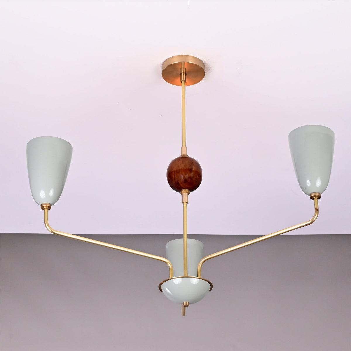 Front view of Milan Cone Arm Chandelier with three cone shades, curved arms, and central decorative sphere.