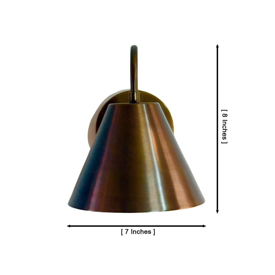 Milan curved arm cone wall sconce installed beside a bed providing warm downward ambient lighting, Model 32791