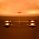 Milan Disc Linear Chandelier installed on ceiling with six black disc shades and warm upward glow.