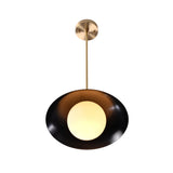 Milan Disc pendant with black dome shade and glowing globe diffuser in a clean Mid-Century Modern design.