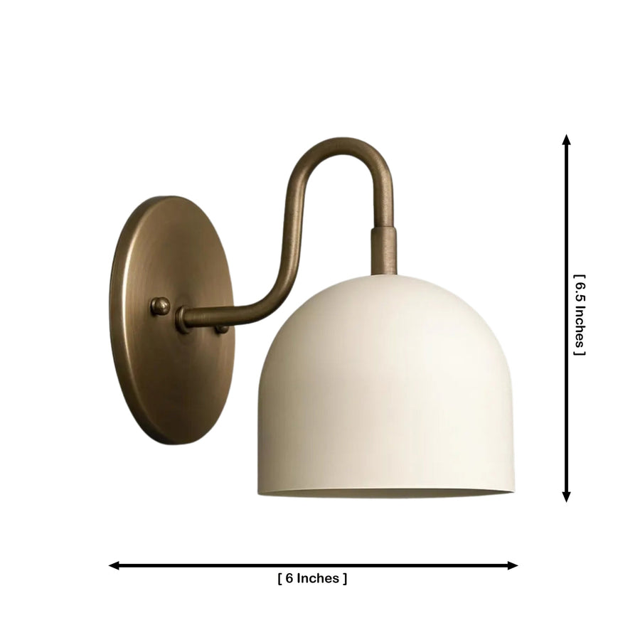 Milan Dome Wall Sconce installed in a modern hallway, providing warm ambient lighting above a wooden console table with contemporary décor in a Scandinavian-inspired interior.