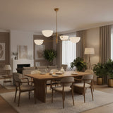 Straight product view of Milan 4-light chandelier with white opal bowl shades, brass frame, and ceiling downrod.