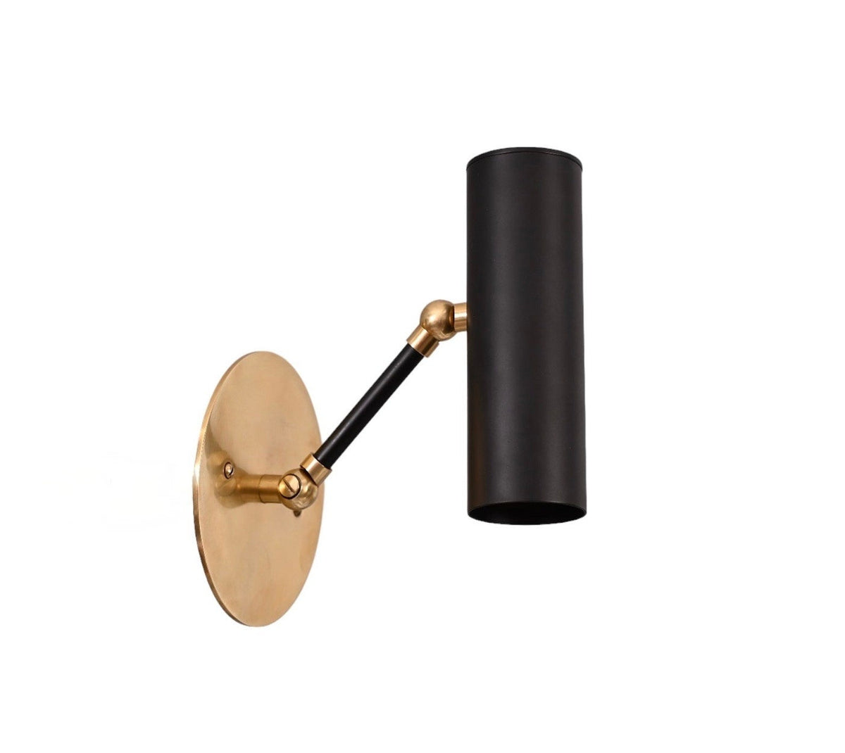 Adjustable brass wall sconce with black cylinder shade mounted vertically on round brass backplate