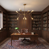 Munich 8 light brass multi-arm chandelier shown from an angled view with branching arms and exposed globe bulbs.