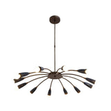 Mykonos 12 light curved arm Sputnik chandelier illuminated in an elegant living room with warm ambient lighting.