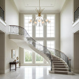 Alternate view of Orion 10 light Sputnik chandelier featuring white elongated cone shades and warm brass radial frame.