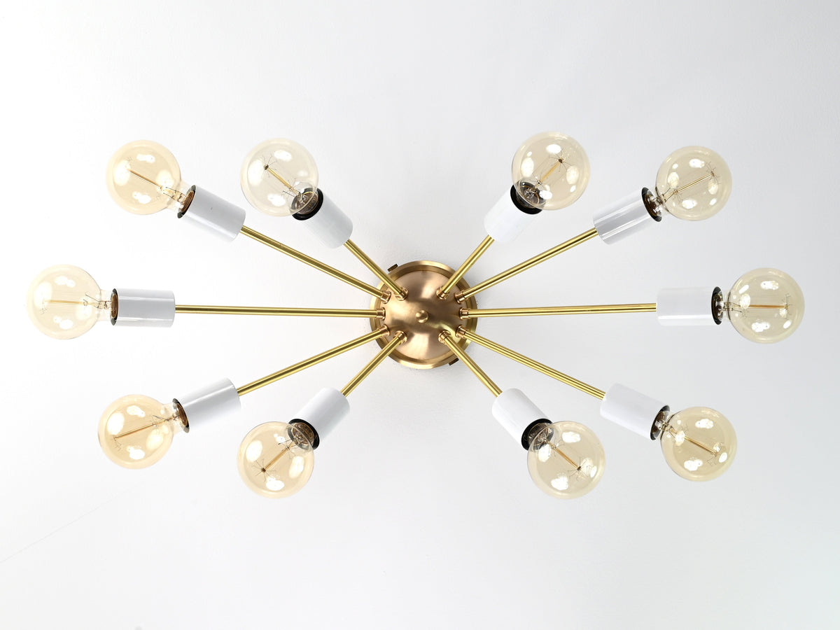Bottom view of Oslo Sputnik ceiling light showcasing symmetrical ten-arm arrangement with white socket covers and exposed bulbs.