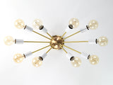 Bottom view of Oslo Sputnik ceiling light showcasing symmetrical ten-arm arrangement with white socket covers and exposed bulbs.