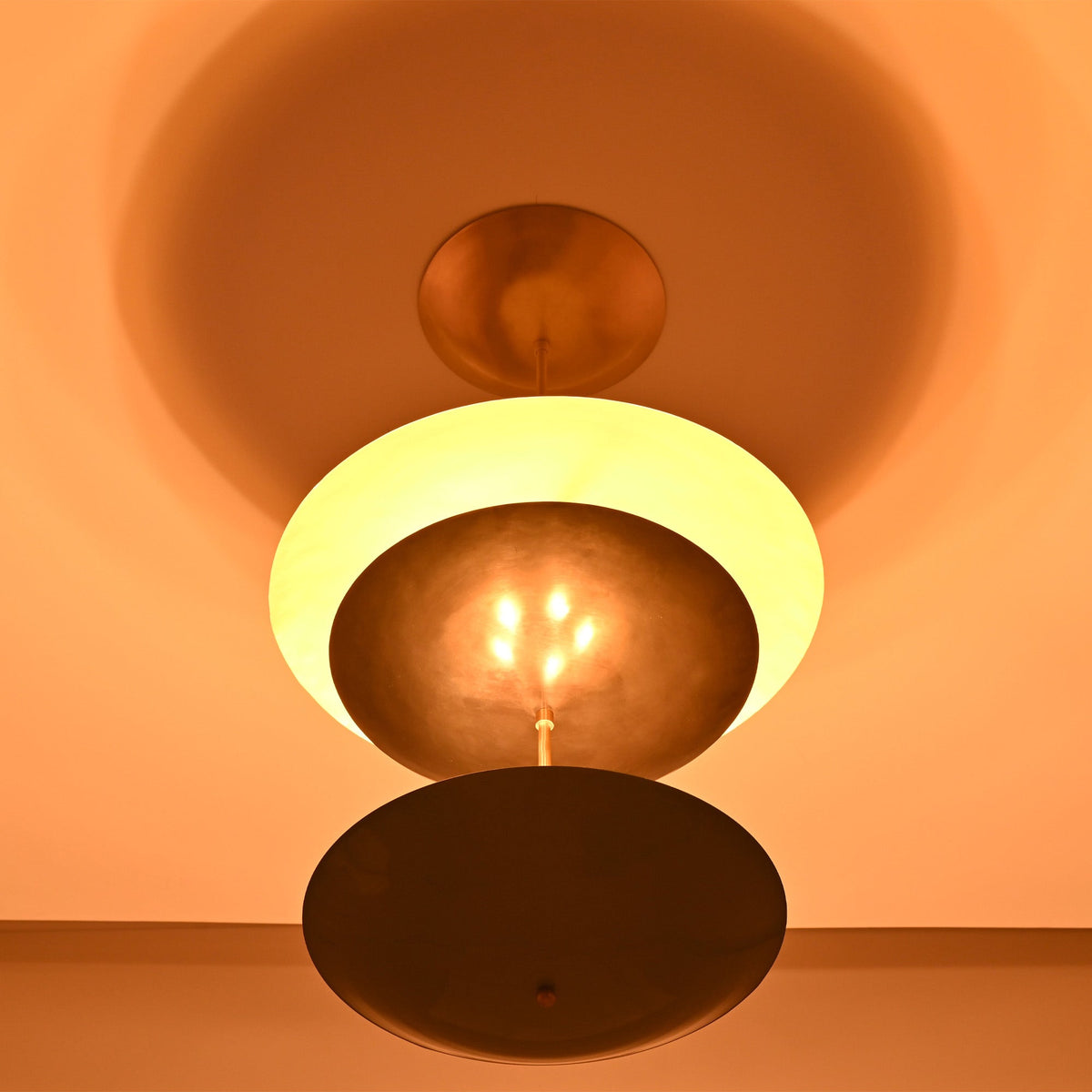 Palermo Tiered Saucer Chandelier close ceiling view with warm glow and layered circular shade design.
