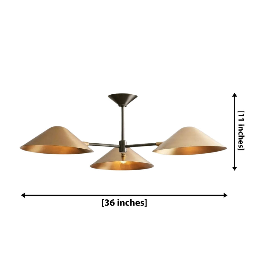 Santorini 3 light sculptural cone chandelier displayed above a round wooden dining table with warm illuminated brass-tone shades.