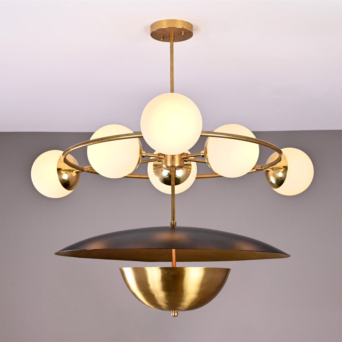Siena Globe Disc Chandelier with six glowing globe lights, circular frame, and layered disc shade front view.
