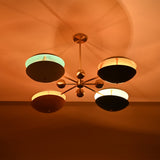 Siena Orbit Globe Chandelier installed on ceiling with warm light effect and colorful layered shades.