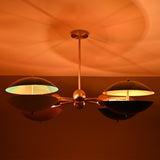 Siena Orbit Globe Chandelier close ceiling view with warm ambient glow and sculptural orbit frame.