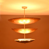 Siena Three Tier Disc Chandelier close-up with glowing stacked discs, ideal for modern dining and living spaces.