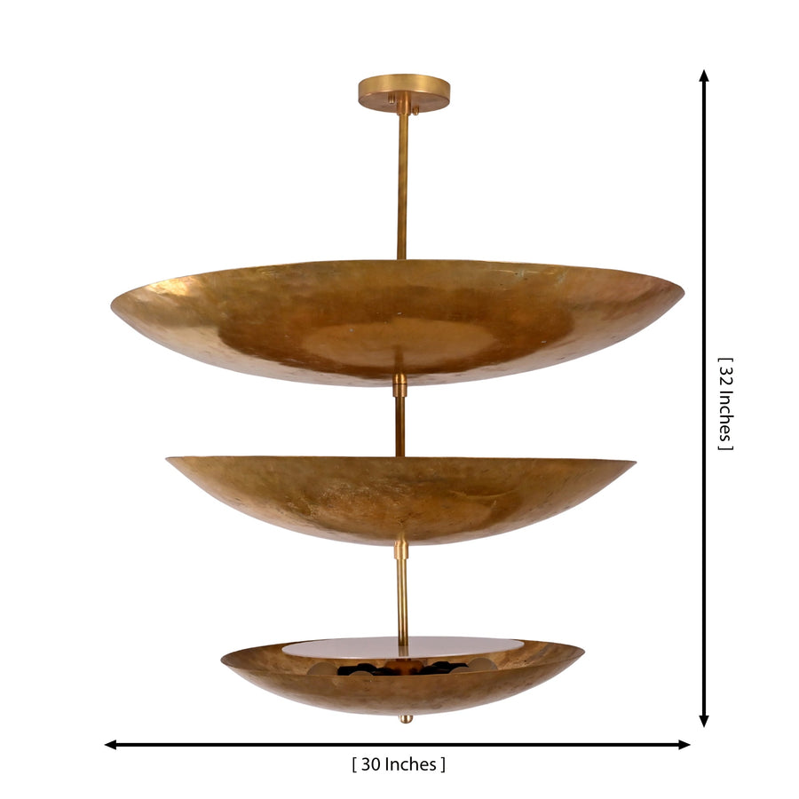 Siena Three Tier Disc Chandelier styled above a dining table in a warm modern interior with ambient lighting.