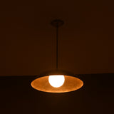 Full view of glowing single dome brass pendant lamp, modern handmade ceiling lighting design