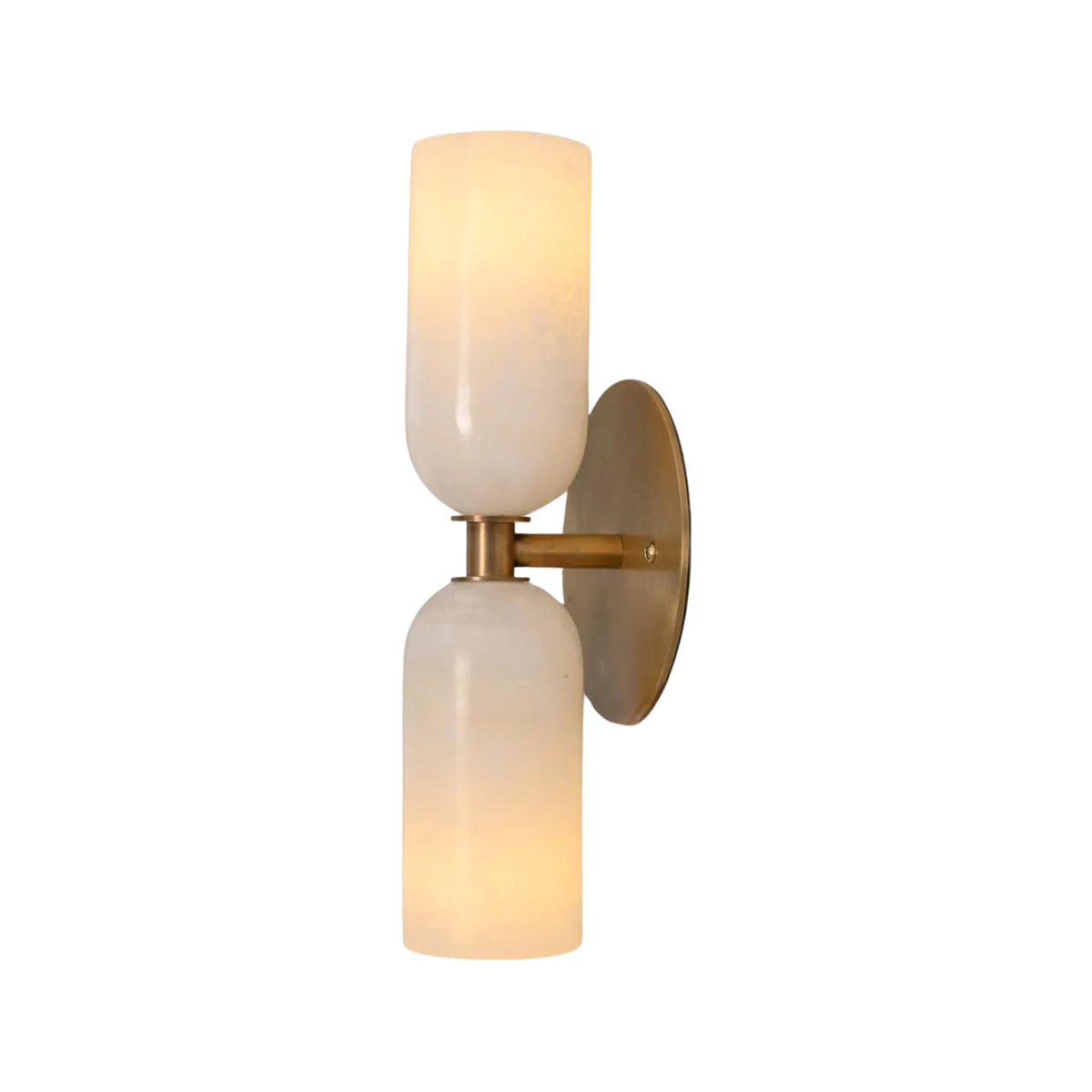 Front illuminated view of the Sloane Double Cylinder Alabaster Wall Sconce in solid brass featuring handcrafted natural alabaster cylinder shades.