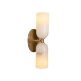 Three-quarter illuminated view of the Sloane Double Cylinder Alabaster Wall Sconce highlighting the translucent natural alabaster shades.