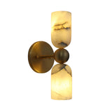 Front angled view of the Sloane Dual Alabaster Cylinder Wall Sconce featuring handcrafted natural alabaster shades, solid brass backplate, and sculptural sphere center.
