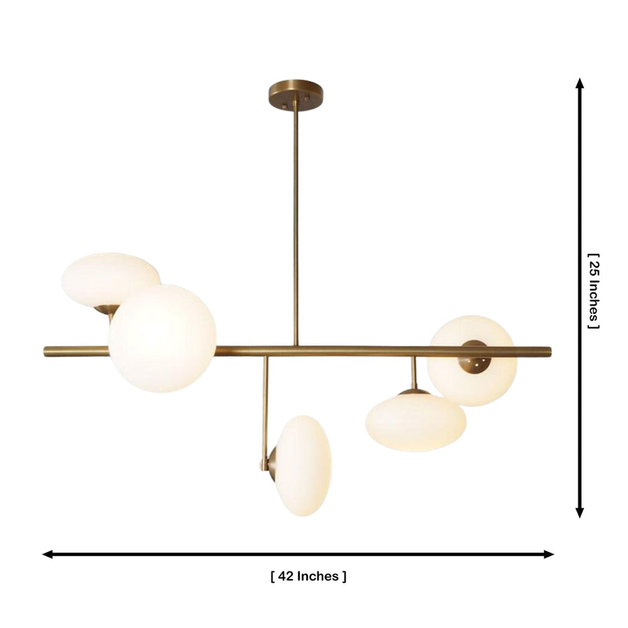 Sloane 5 light linear opal glass chandelier with brass frame displayed above a modern dining table.
