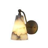 Side profile of the Sloane tapered alabaster wall sconce featuring a sculptural curved brass arm supporting a handcrafted natural alabaster cone shade.