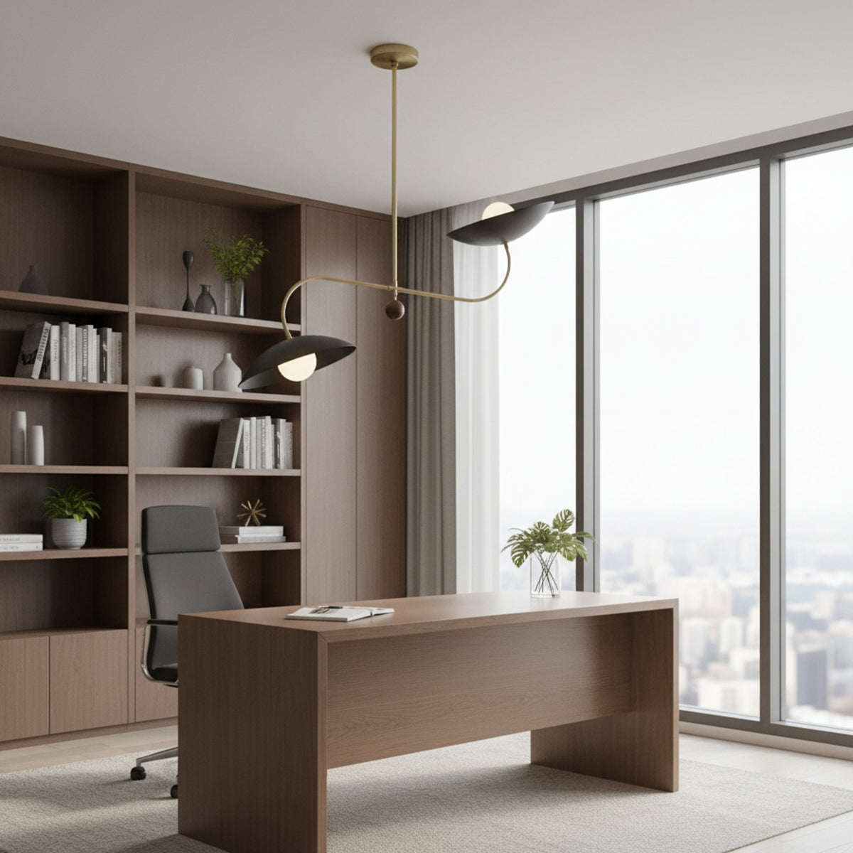 Strasbourg 2 light black disc chandelier shown illuminated from the front with warm globe bulbs and an asymmetrical brass-tone frame.