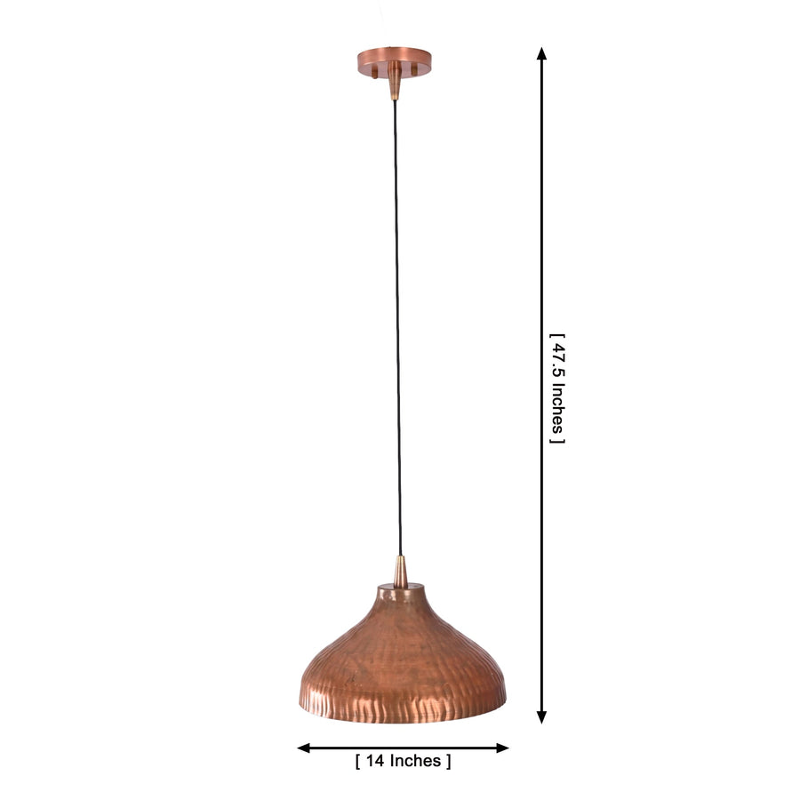 Sutton hammered copper dome pendant light installed above a wooden dining table in a modern farmhouse dining room with warm ambient lighting.
