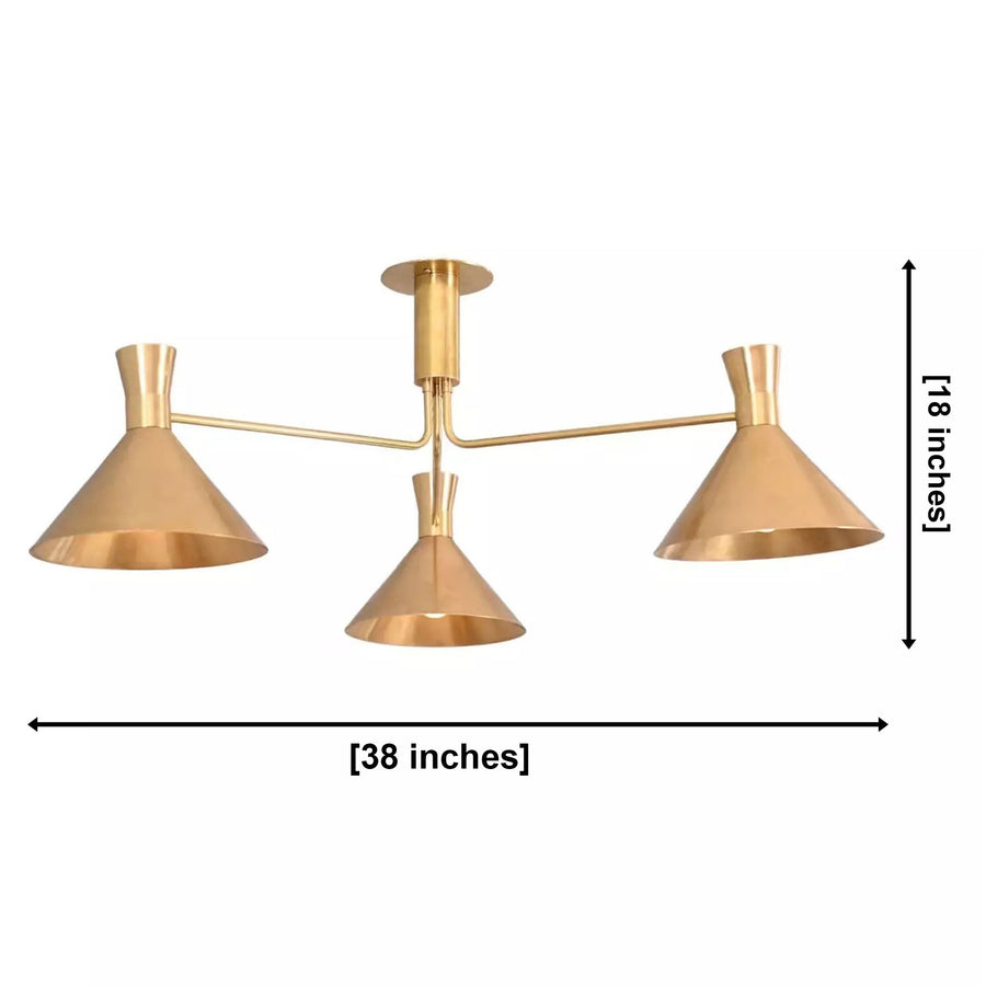 Sutton 3 light brass linear cone chandelier installed above a dining table in a warm modern kitchen interior