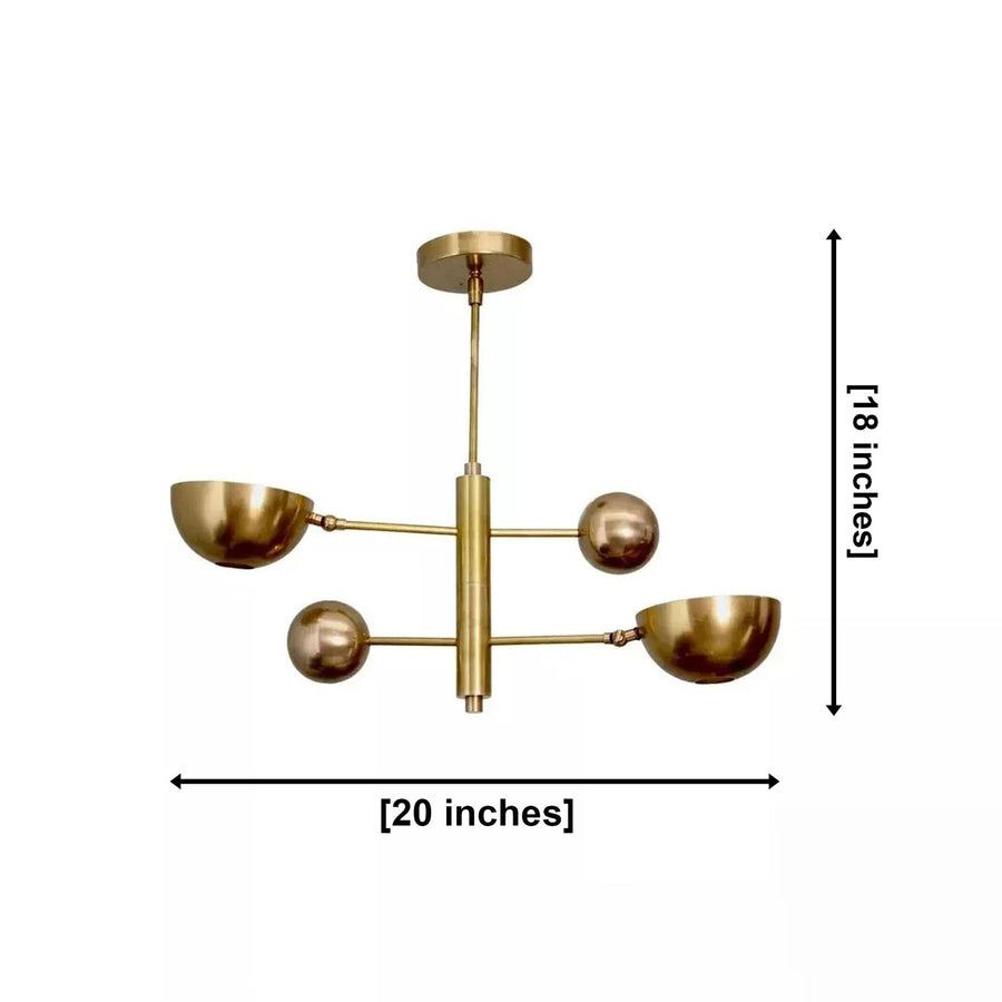 Venice 2 light brass orb and bowl chandelier installed above a round dining table in a warm modern dining room.