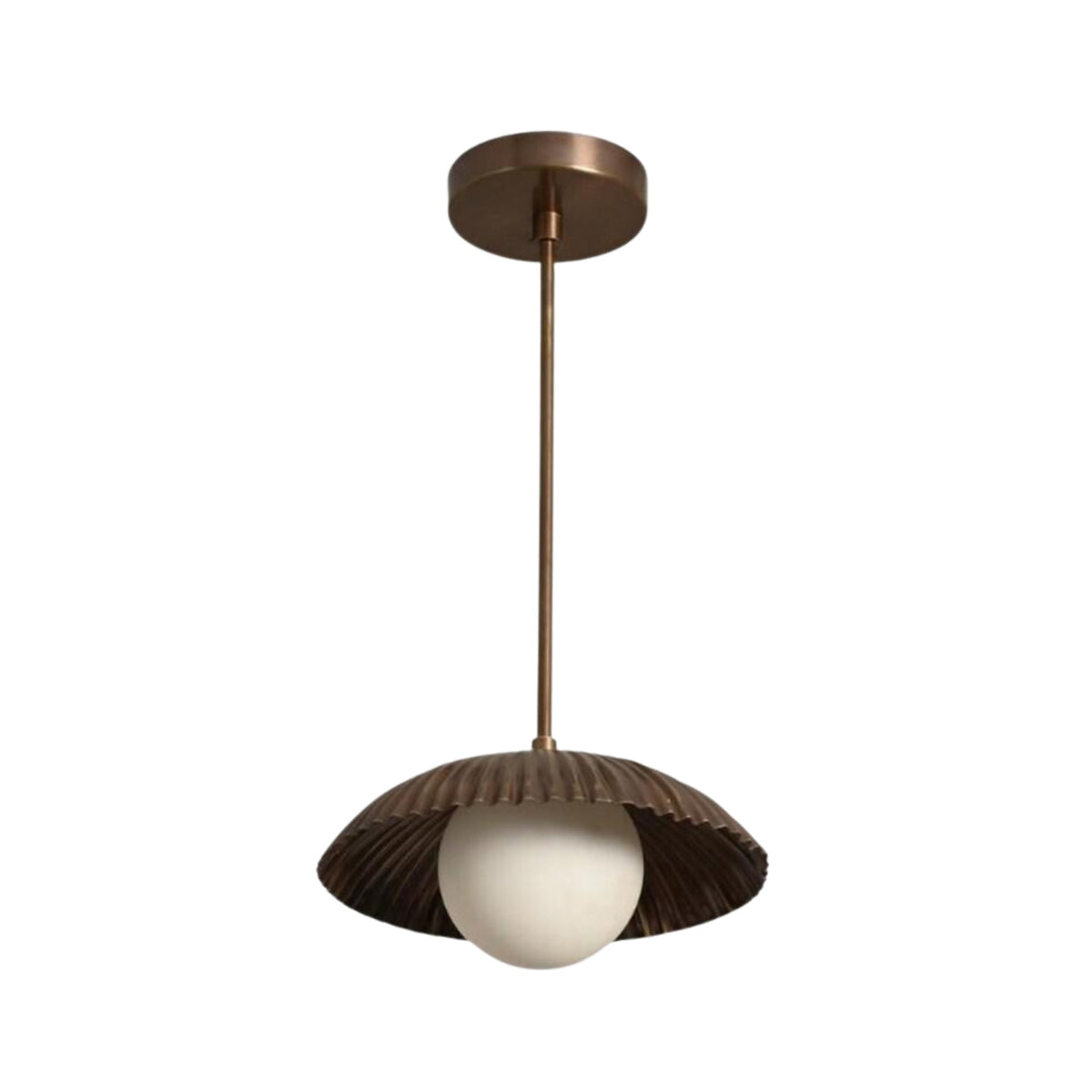 Angled perspective of the Verona Fluted Dome Pendant Light showcasing its fluted dome silhouette, frosted globe light, and minimalist suspended design.