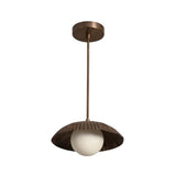 Angled perspective of the Verona Fluted Dome Pendant Light showcasing its fluted dome silhouette, frosted globe light, and minimalist suspended design.