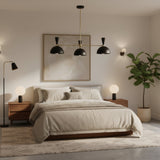 Verona 3 light mid-century black dome chandelier with brass-toned arms on a white background.