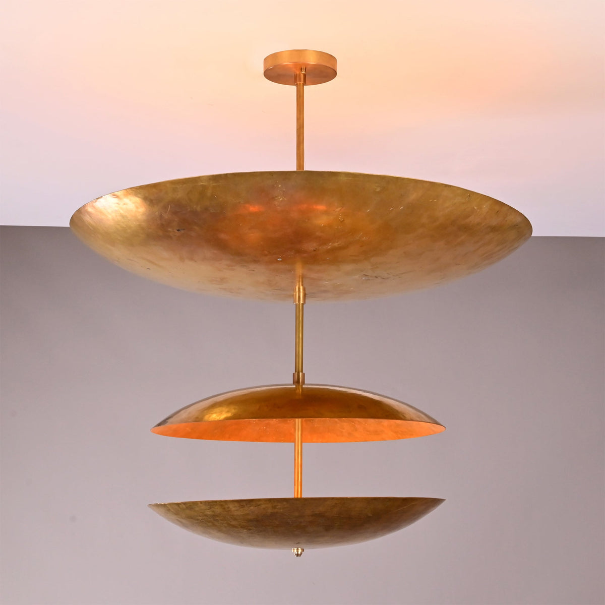 Angled view of Verona Triple Saucer Chandelier showing layered saucer form and refined ceiling-mounted design.