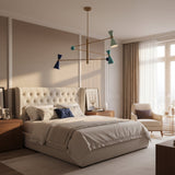 Wellington 3 light counterbalance chandelier shown illuminated from an angled view with colorful cone shades and spherical accents.