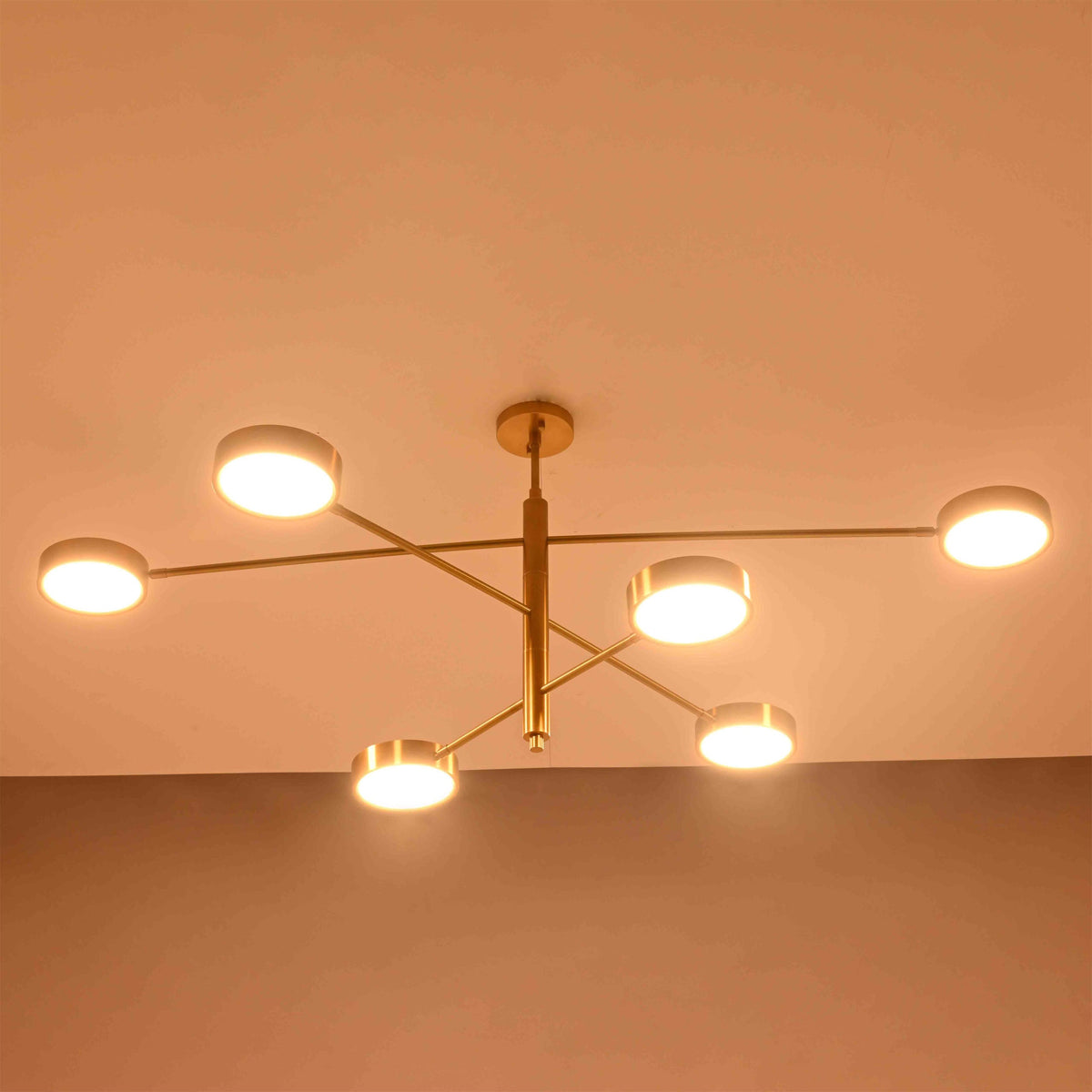 Architectural disc ceiling light fixture with six circular lamps and wide 60 inch linear layout