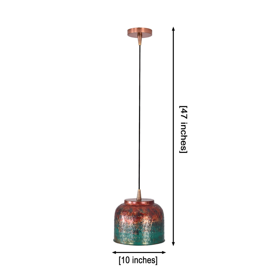 Multicolor copper drum pendant light hanging above a kitchen island with warm downward glow and artistic textured shade