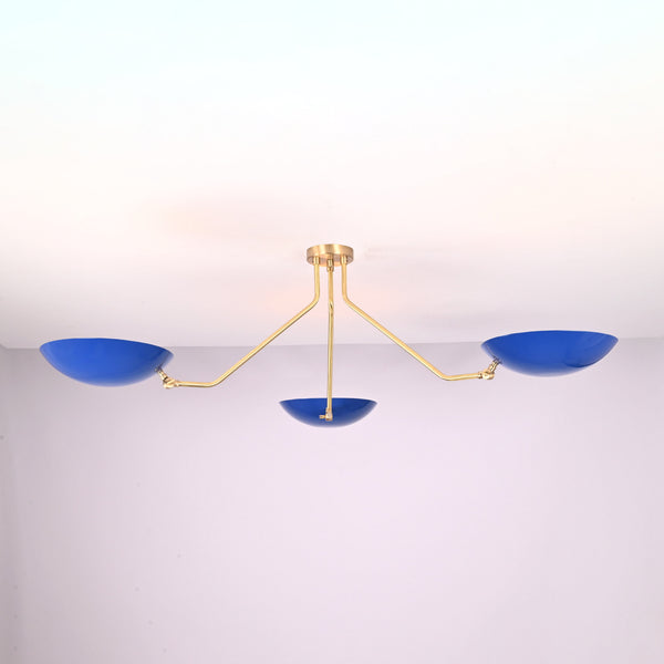 Modern three-light flush mount ceiling light with blue bowl shades and brushed brass arms by Brass Leaf Studio