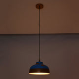 Blue and copper dome pendant lights installed in a hallway, adding warm glow and decorative ceiling lighting