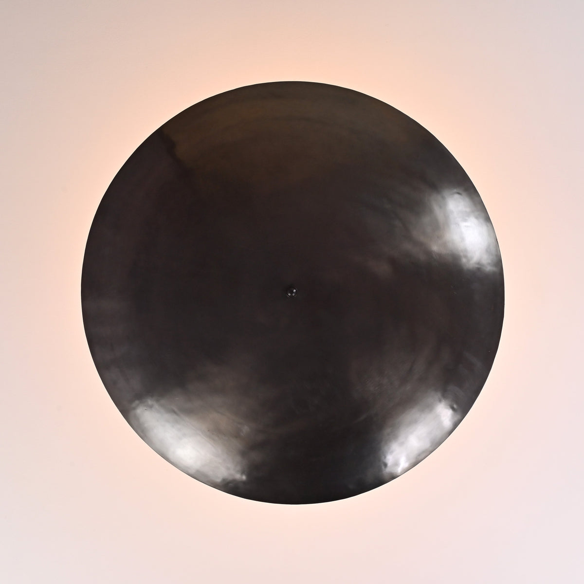 Close-up of solid brass bowl ceiling light showcasing smooth satin finish