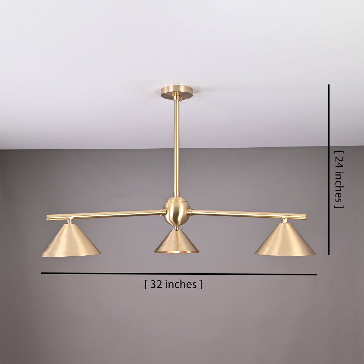 Handcrafted brushed brass 3-light cone chandelier with minimalist arms and sculpted shades, size 32 inches wide and 24 inches high.