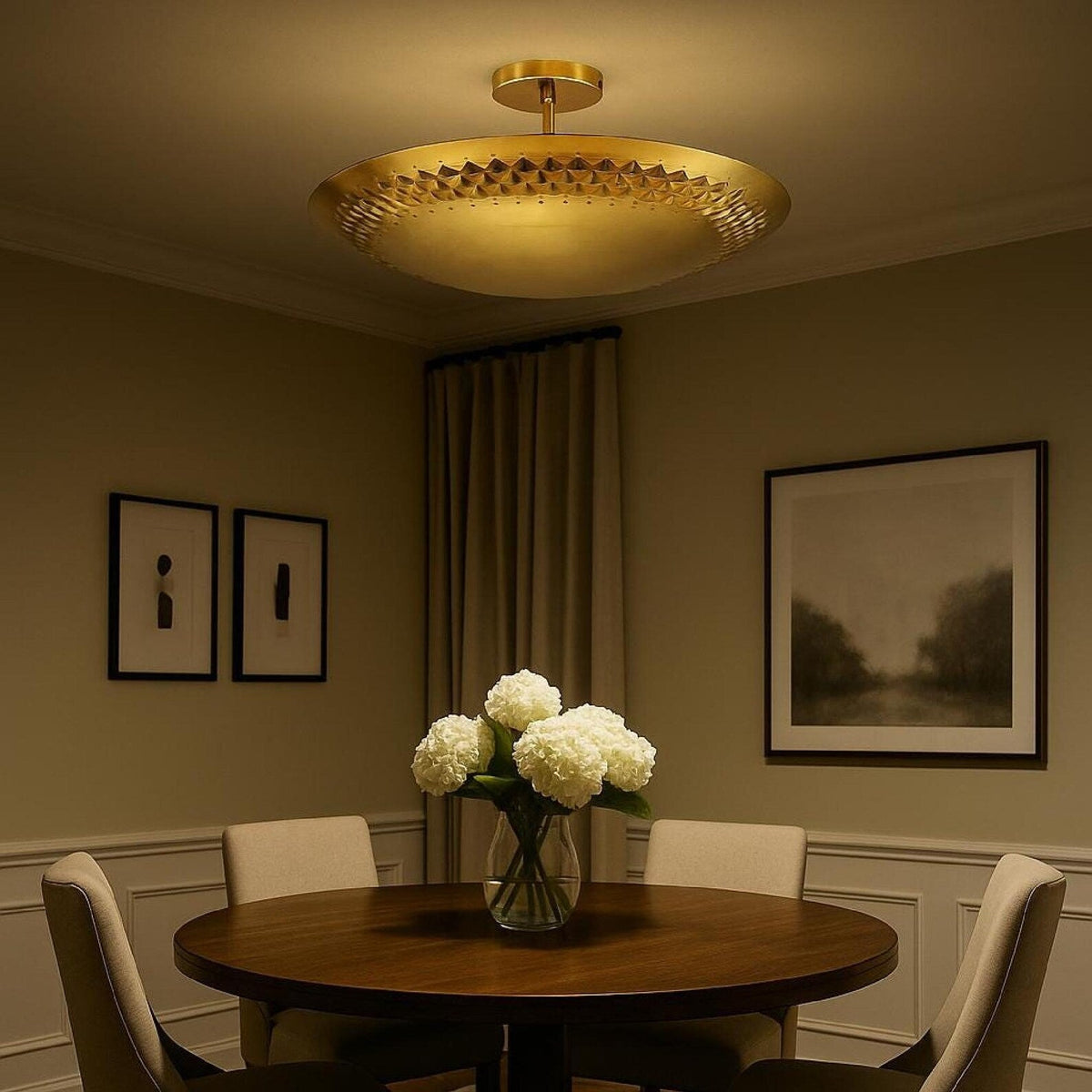 3 light brass disc style flush mount chandelier installed above a dining table