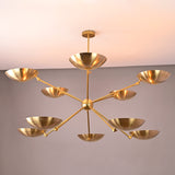 Wide 59-inch brass bowl chandelier showcasing ten sculptural uplight bowls on extended brass arms.