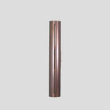 Slim vertical profile of handmade brass wall sconce, showcasing sleek industrial design with elongated cut detail.