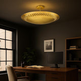 Solid brass disc flush mount ceiling light installed in a modern home office space